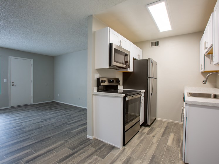 Renovated apartment kitchen in Tucson with new cabinetry at The Vintage on Speedway Blvd.